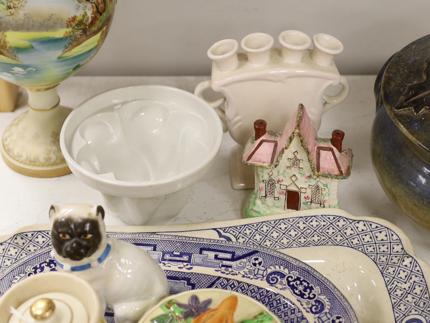 A large pottery tureen and cover, a large centrepiece and mixed ceramics including meat platters
